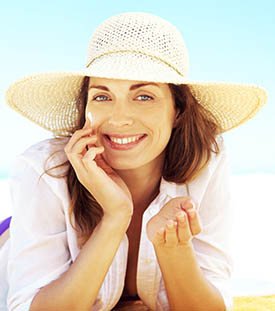 Woman knows how to protect her skin and Let the Vitamin D in.